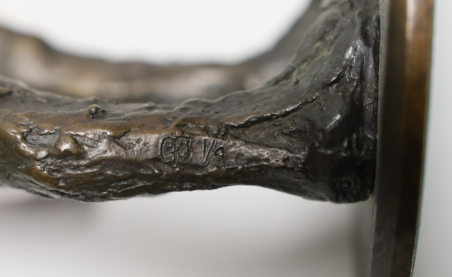 Bronze: pressed mark stamped to right ankle, one of nine, a figural male nude bronze, 35cms high